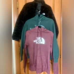 Lot (3) of The North Face women’s sweatshirts (2) and reversible Jacket. Size M